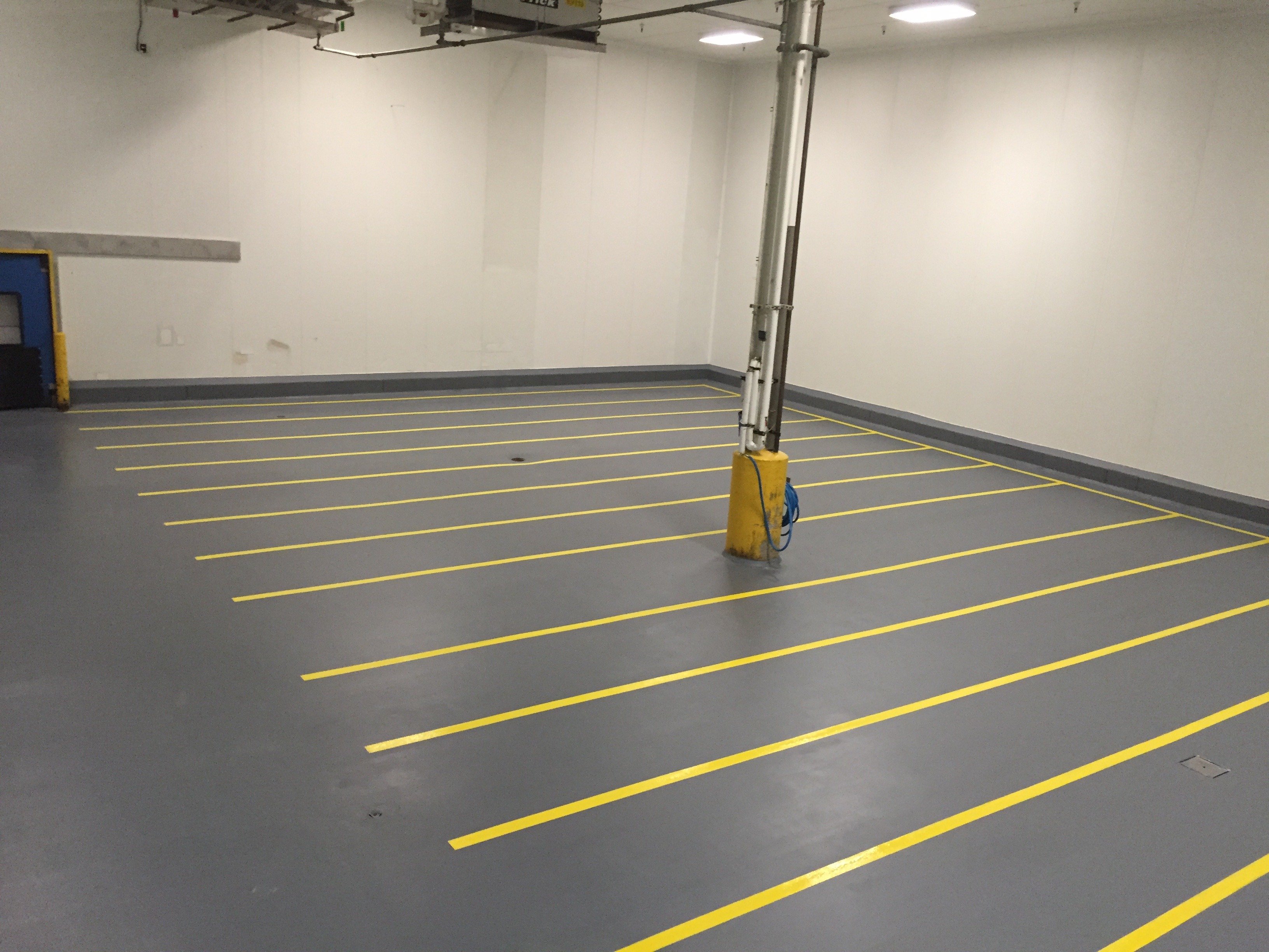 Dark Grey urethane cement flooring with safety lines