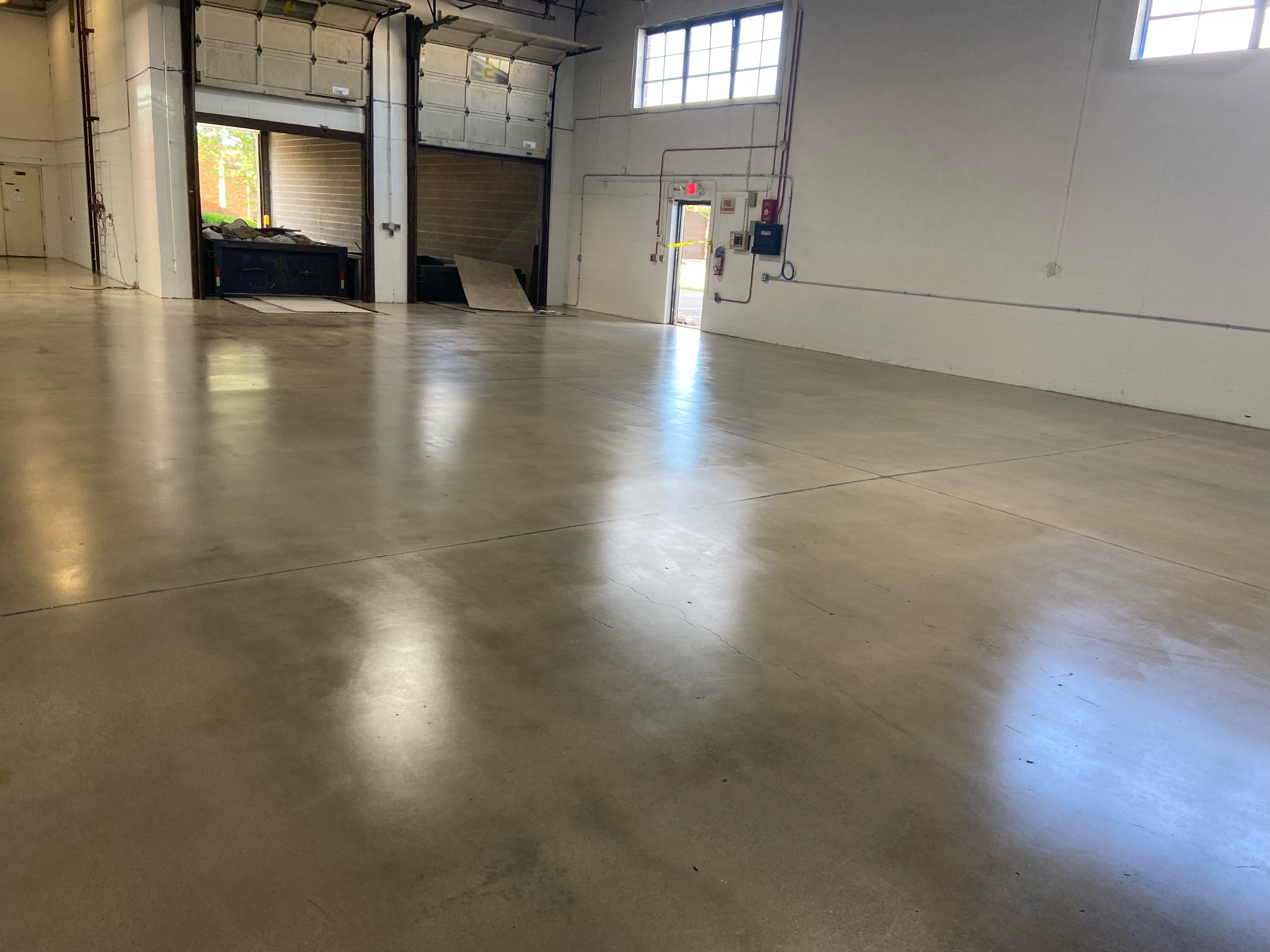 Acrylic grind and seal floor with garage bay doors in illinois