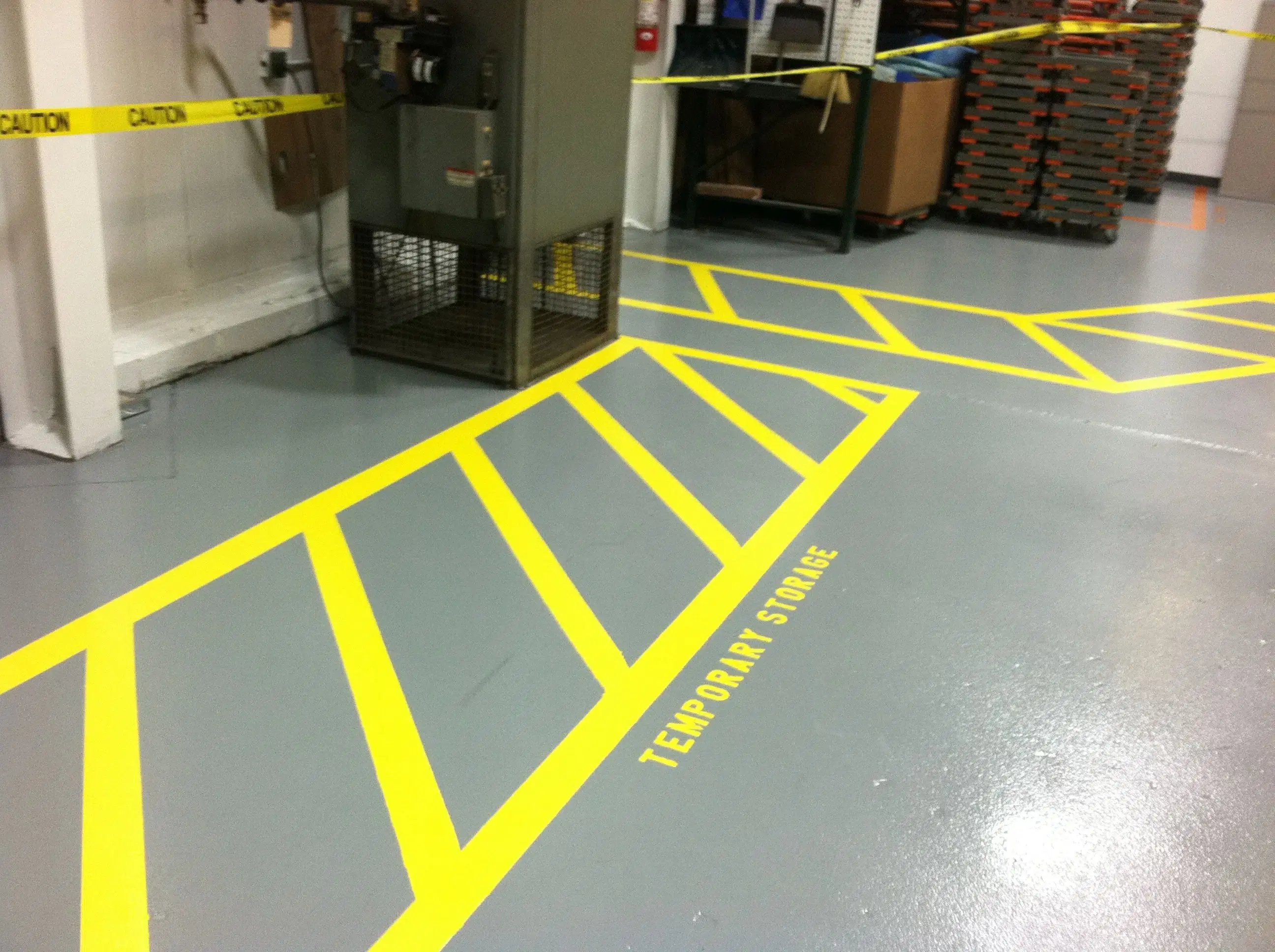 yellow Access Striping for temporary storage on a coated concrete floor