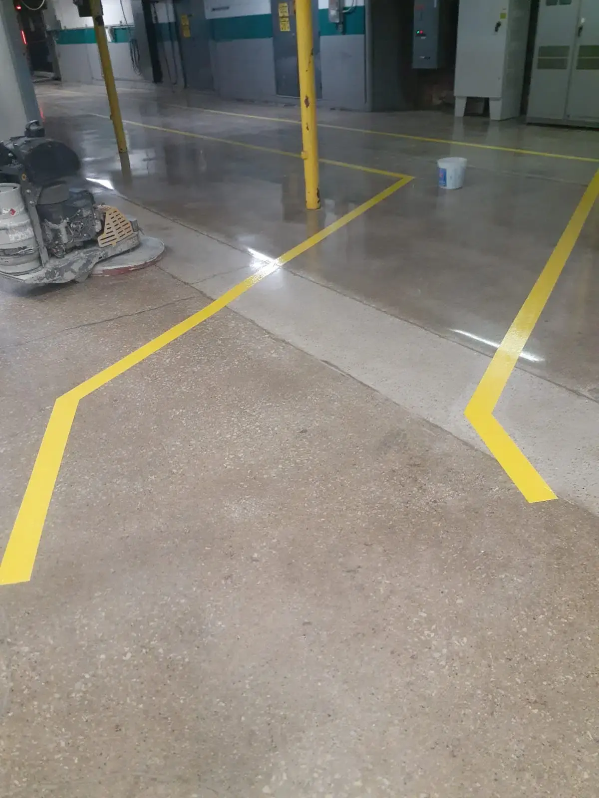 Polished Concrete  in a warehouse with yellow safety lines
