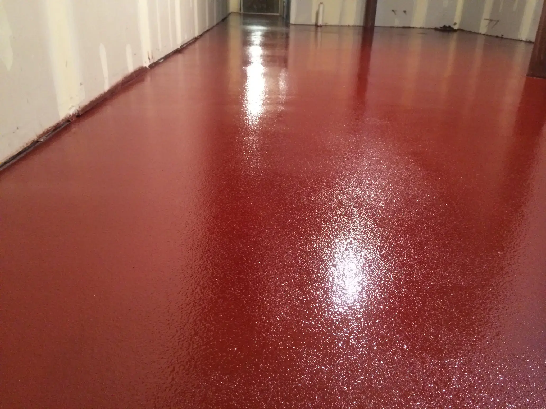 striking red epoxy floor with texture in a Chicago based manufacturing plant
