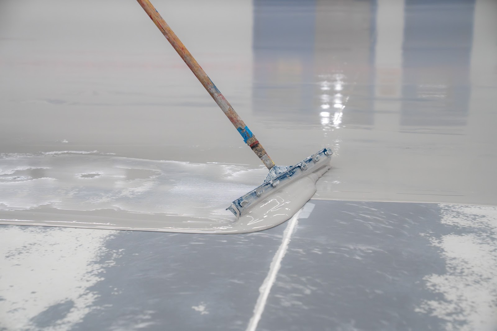 Squeegee with concrete coading